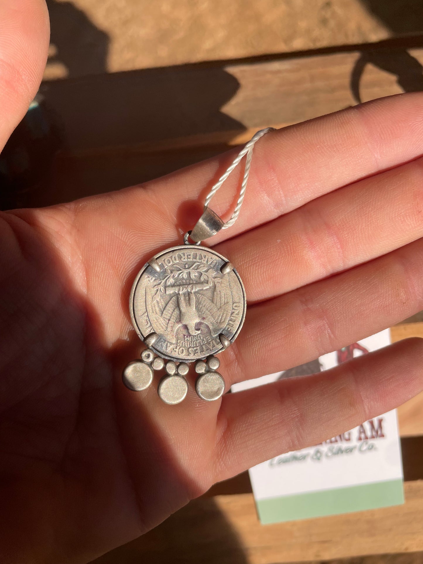 Navajo made quarter pendant